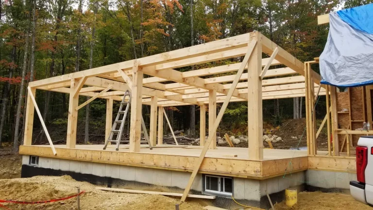 Timber frame addition with floor joists and posts on a block foundation