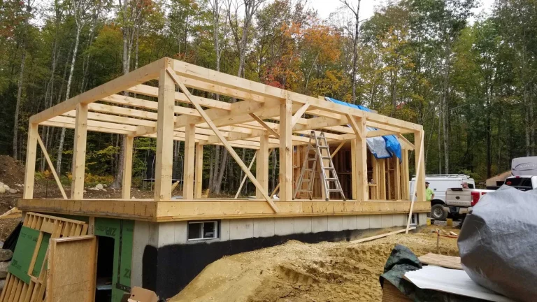 Timber frame addition with rafters raised on a block foundation