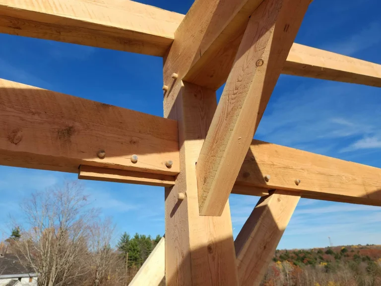 Close-up of mortise and tenon timber frame joinery with wooden pegs